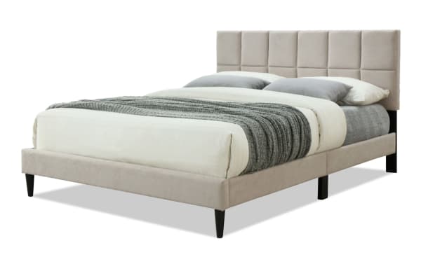 River King Taupe Upholstered Platform Bed in tan polyester fabric with tufted headboard, wood frame, and sleek tapered legs, transitional style.