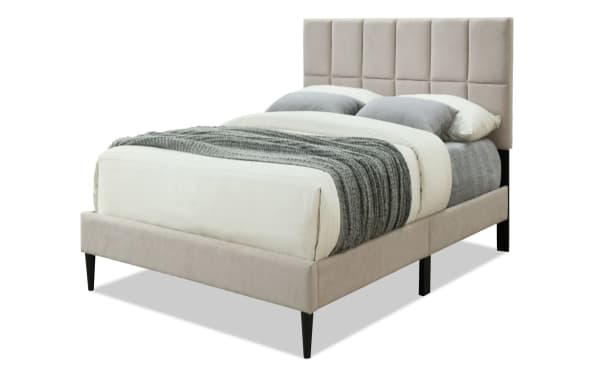 River Twin Taupe Upholstered Platform Bed with tufted polyester fabric headboard, wood frame, and tapered black legs in transitional tan style.
