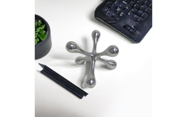 5'' Ozi Silver Decorative Jack crafted from metal with a sleek silver finish, featuring a transitional style ideal for modern home décor accents.