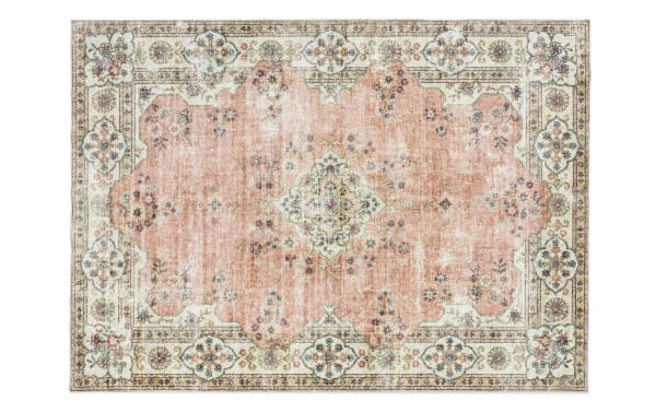 Kinsley 5' x 7' pink traditional washable rug with floral medallion pattern, stain-resistant polyester fabric, and non-slip backing for high-traffic areas.