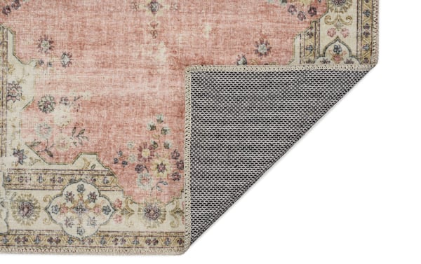Kinsley 5' x 7' Pink Traditional Washable Rug with floral pattern, polyester fabric, non-slip backing, and machine-washable stain-resistant design.