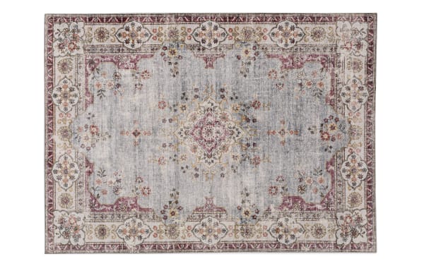 Kinsley 5' x 7' light blue traditional washable rug with floral medallion pattern, stain-resistant polyester fabric, and non-slip backing for high-traffic areas.