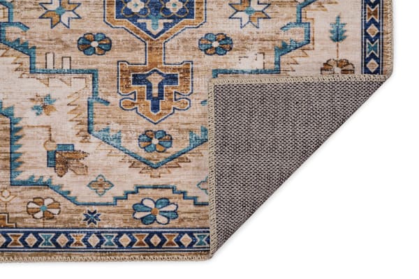Traditional Norah 5' x 7' ivory washable rug with beige and blue floral geometric pattern, stain-resistant polyester fabric, non-slip backing.