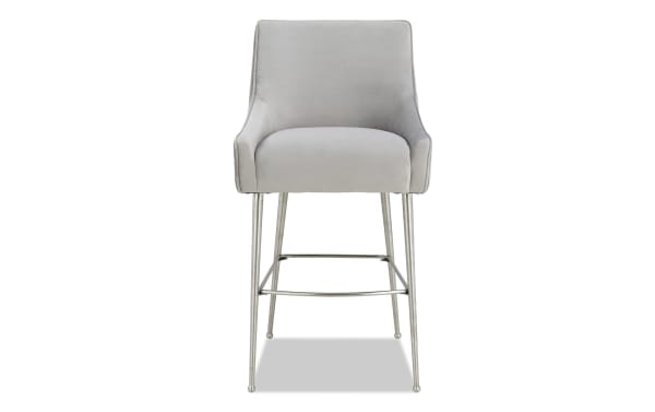 Giselle Light Gray Solid Back Counter Height Stool with soft velvet upholstery, stainless steel legs, and contemporary design from the Giselle collection.