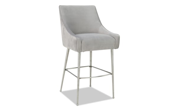 Giselle Light Gray Solid Back Bar Height Stool with soft velvet upholstery, stainless steel legs, and a contemporary solid back design.