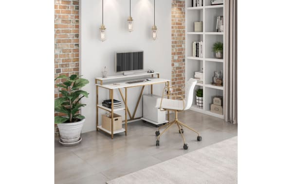 Contemporary Audra White & Gold Writing Desk with MDF top, powder-coated gold steel frame, two-tier side shelf, elevated hutch shelf, and headphone hook.