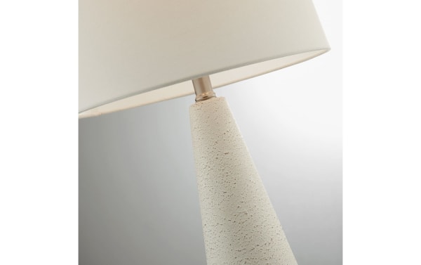 Contemporary Karter White Table Lamp with angled textured ceramic base and white linen fabric shade, ideal for bedside or living room lighting.
