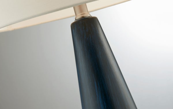 Contemporary Karter Blue table lamp in white ceramic with fabric shade, featuring a hand-crafted water-flow design for modern decor.