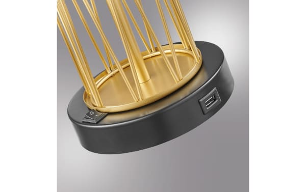 Close-up of the Dallas Gold Table Lamp base showing black metal with a power switch and built-in USB port for device charging, featuring gold metal rods in a contemporary style.