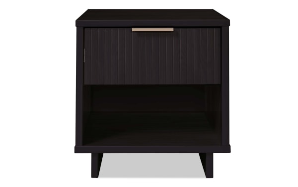 Ascias Black Nightstand with Drawer in solid wood, contemporary style with vertical ribbed front, black UV paint finish, metal handle, soft-close drawer, and open bottom shelf.