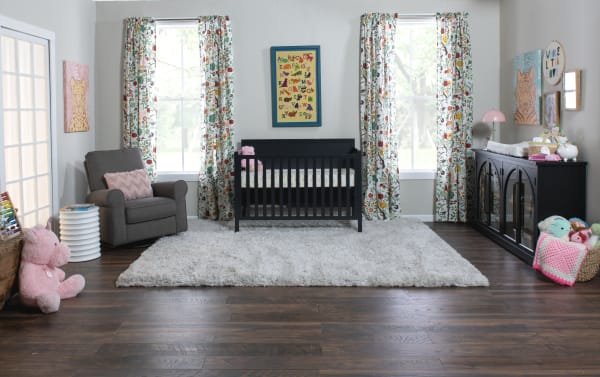 Transitional Ollie Navy toddler bed conversion rail in navy pine solids and laminated veneer lumber, designed to convert Ollie 4-in-1 crib for toddler safety.