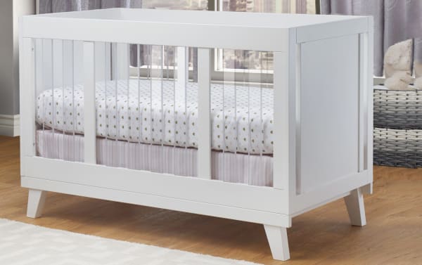 Contemporary Olive White Crib with clear acrylic slats, solid pine and MDF wood panels, featuring adjustable mattress heights for nursery safety.