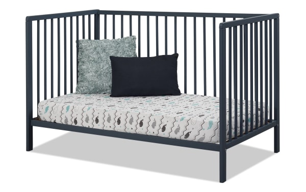 Primrose Navy 3-in-1 Convertible Crib from Primrose Avery collection, navy blue beech wood with vertical slats, converts to toddler bed.