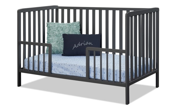 Avery Navy 3-in-1 Convertible Crib from Primrose Avery collection in contemporary style, made of solid beech wood and plywood with navy finish, featuring gently contoured corners, three adjustable mattress heights, and a toddler rail conversion option.