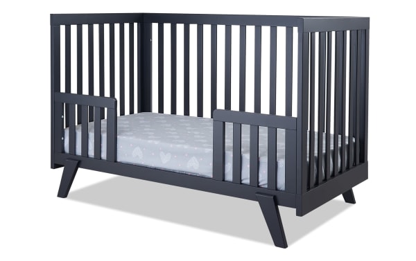 Serenity Navy 2-in-1 Convertible Crib in contemporary mid-century style, made of navy beech wood with angled legs and flat slats, converts to toddler bed.
