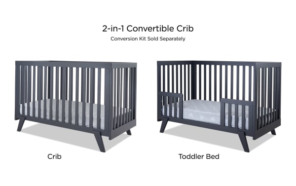 Serenity Navy 2-in-1 Convertible Crib in contemporary navy blue beech wood with flat slats and angled legs, converts from crib to toddler bed.