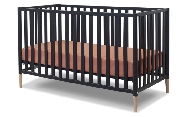 Jasper Navy 3-in-1 Convertible Crib in solid wood with navy finish, natural wood legs, and Scandi-inspired contemporary design.