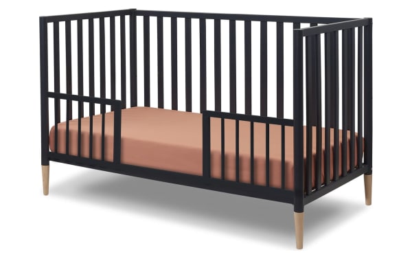 Jasper Navy 3-in-1 Convertible Crib in solid wood with navy finish, removable feet, and Scandi-inspired design; converts to toddler bed and daybed.