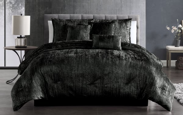 Zoey Queen Black Solid Velvet 7 Piece Comforter Set in metallic crinkle black polyester velvet with a glam style, including matching shams and decorative pillows.