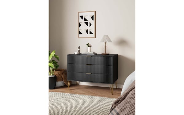 Delilah Black 3 Drawer Dresser with vertical ribbed MDF fronts, gold metal splayed legs, and soft-close drawers in contemporary style.