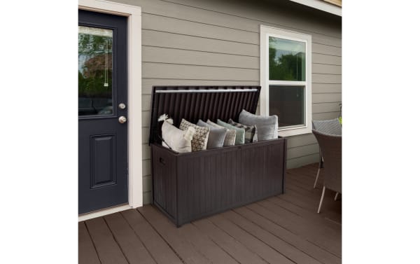 Contemporary Osgood 113 Gallon Brown Outdoor Storage Box with faux-wood resin slat design, metal hinges, waterproof, fade-resistant, large patio storage.