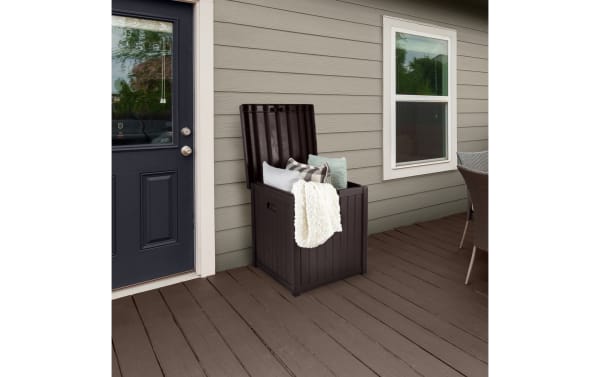 Osgood 50 Gallon Brown Outdoor Storage Box in contemporary style, made of durable resin with waterproof, fade-resistant faux-wood slat design and easy-open lid for patio organization.