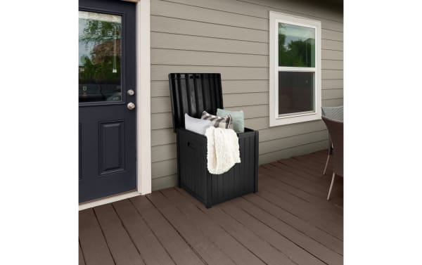 Osgood 50 Gallon Black Outdoor Storage Box in contemporary style with durable resin faux-wood slat design, waterproof and fade-resistant for patio organization.