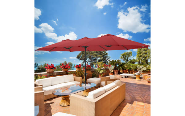 Contemporary Gomez 15' red outdoor market umbrella with fade- and water-resistant polyester canopy, steel ribs, and hand crank for patio sun protection.