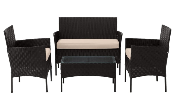 Callum 4 Piece Black Rattan Outdoor Conversation Set with beige cushions, including two chairs, loveseat, and glass-top coffee table. Durable PE rattan and powder-coated steel in contemporary style for patio use.