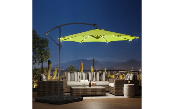 Ciello 10' lime green LED outdoor cantilever umbrella with 32 solar-powered lights, metal frame, and weather-resistant polyester canopy in transitional style.