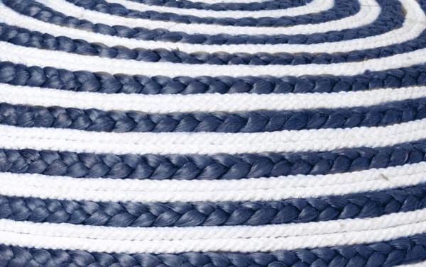 Bohemian Cameron Blue Striped Pouf with hand-woven blue and white cotton-jute fiber braids, offering durable, soft upholstery and unique optical design.
