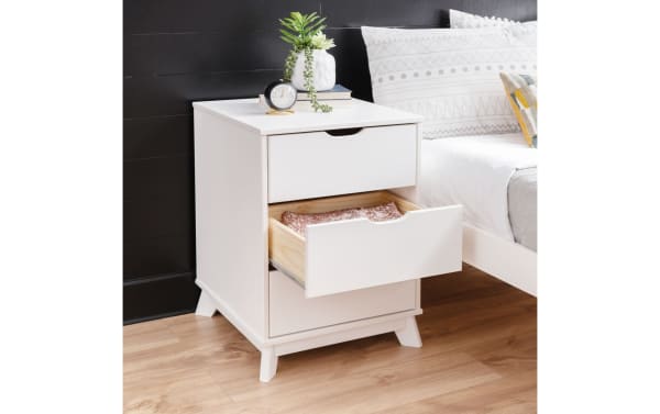 Phoebe White 3 Drawer Nightstand in transitional style with solid pine and MDF construction, featuring three spacious white drawers with cut-out handles and a sturdy frame.