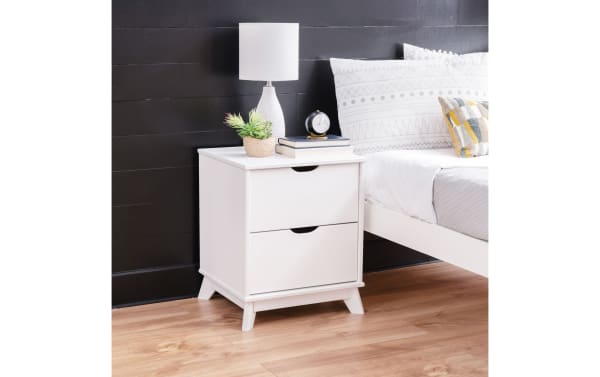Phoebe White 2 Drawer Nightstand in transitional style with solid pine and MDF construction, featuring a white finish, cut-out handles, and spacious drawers.