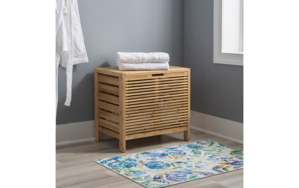 Branson Natural Hamper in transitional style, made of natural bamboo with slatted sides and wide top lid with safety hinge for laundry storage.