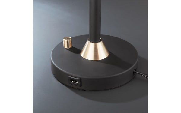 Black metal base of Campana 3 Piece Floor & Table Lamp Set with antique brass accents and built-in USB port for charging devices.