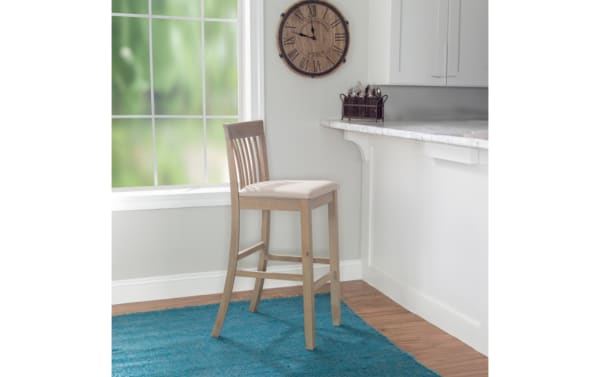 Beige Craftsman Slat Back Bar Height Stool with padded polyester fabric seat, rubberwood and MDF frame, traditional mission style, rustic finish.