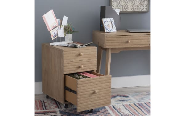 Rylan Natural 2 Drawer File Cabinet in rubberwood solids and MDF with mid-century modern style, natural wood finish, rolling casters, and ribbed drawer fronts.