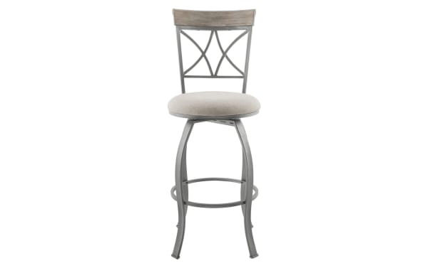 Traditional Homer beige and pewter cross back bar height stool with swivel seat, steel frame, rubberwood top rail, and beige polyester fabric upholstery.