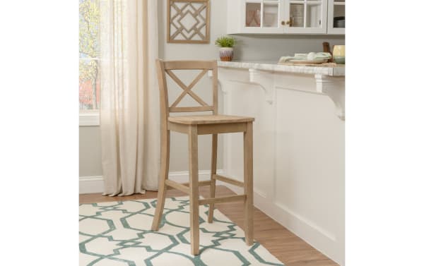 Natural Cross Back Solid Wood Bar Height Stool in rustic light wood finish, rubberwood and MDF construction, with X-back design and clean lines for kitchen or bar seating.
