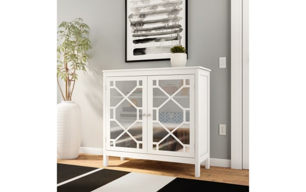 Frankie White 2 Door Cabinet from the Frankie collection features a transitional style with white MDF frame and glass pane doors, offering three interior shelves for versatile storage.