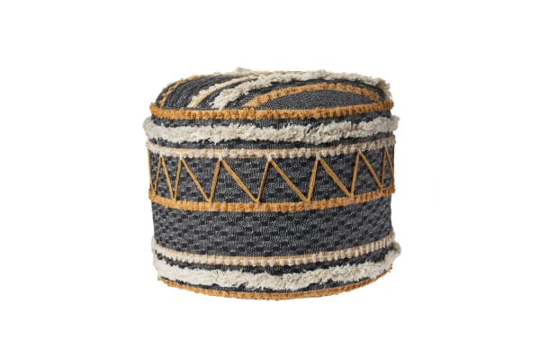 Reyna Black Pouf in black, white, and brown cotton fabric with contemporary geometric patterns, hand-crafted for stylish support and comfort.