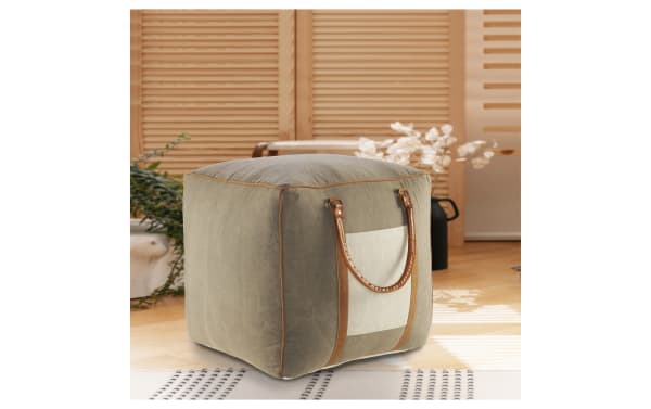 Bellagio Gray Pouf in industrial style with gray cotton fabric, ivory pocket, and brown leather handles. Versatile ottoman, seat, or footrest.