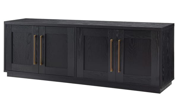 Syvia 68'' Black Storage TV Stand in transitional style, MDF construction, with four paneled doors, brass handles, and dual-level closed shelving for media storage.