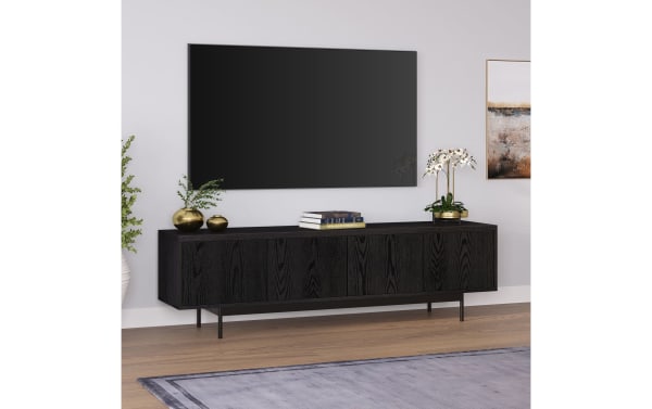 Charlene 70'' black transitional TV stand with MDF and metal materials, featuring four enclosed cabinets and cable management for media storage.