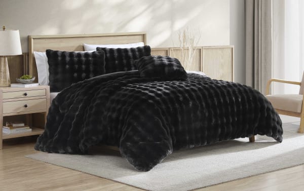 Olivia Full/Queen Black 4 Piece Comforter Set with ruched faux fur polyester fabric, featuring a plush, textured contemporary design for cozy luxury.