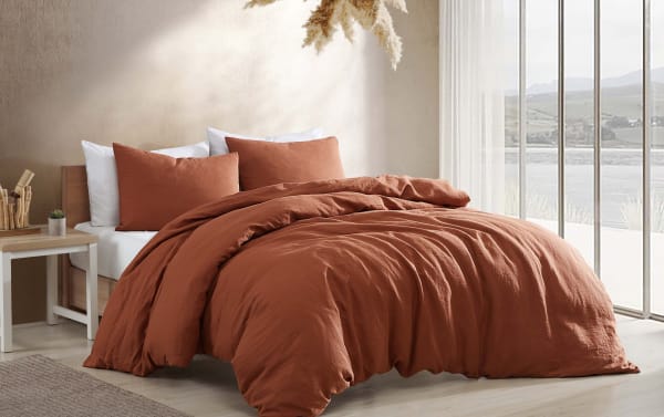 Weston Orange 4 Piece Queen Comforter Set in warm orange linen and polyester fabric, transitional style with plush pillows and cozy duvet cover.