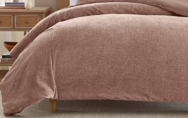 Transitional blush pink polyester fabric comforter from the James Queen Blush 3 Piece Comforter Set, featuring soft pre-washed chenille texture.
