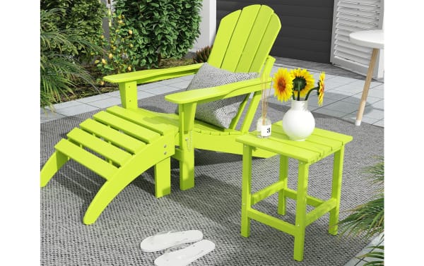 Paloma Lime Green Outdoor Adirondack Side Table in high density plastic, transitional style, shown with matching Adirondack chair and ottoman on patio.