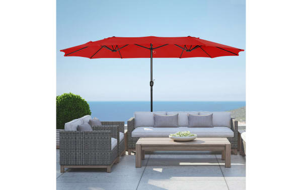Delany Red 9' Twin Outdoor Umbrella in vibrant red polyester fabric with steel frame, providing large transitional-style shade for patio or poolside seating.