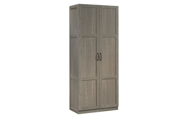 Bella Gray 2 Door Storage Cabinet in rustic gray particle board and metal, featuring four adjustable shelves and black handles for versatile storage.
